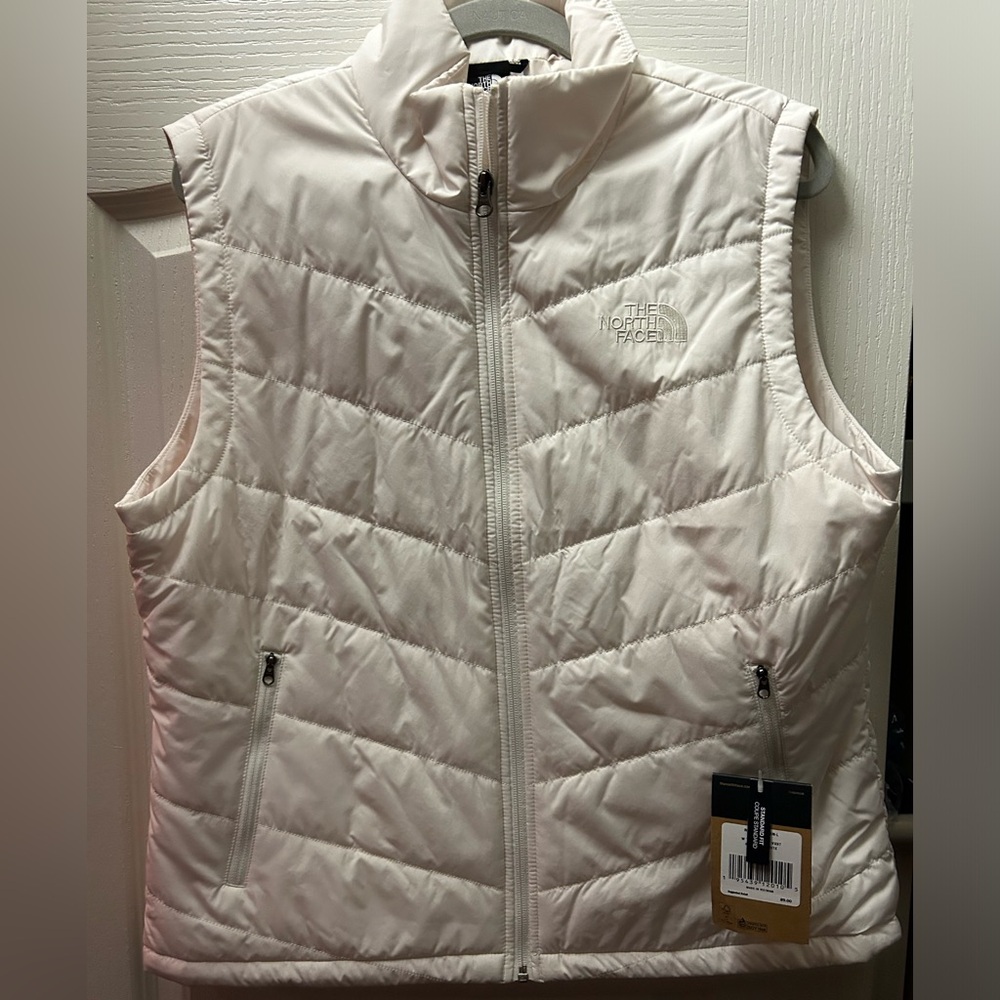 The North Face Snow White puffy vest. NWT. Purchased from Dillards.
